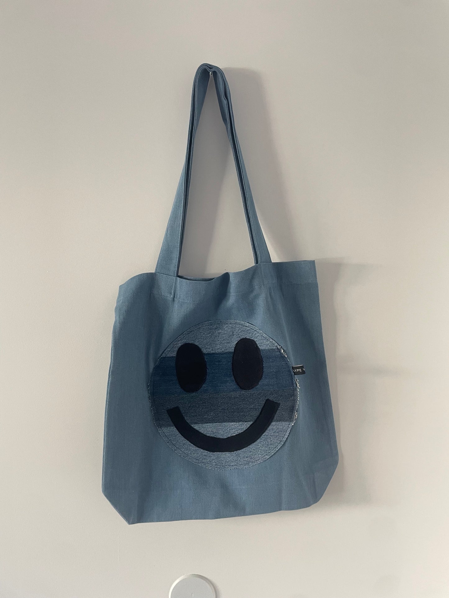 smiley face denim tote
